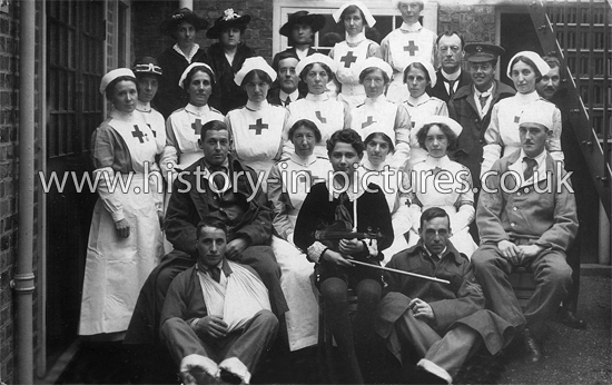 Little Raoul Vidas, with Red Cross Nurses and Wounded Soldiers, Buckhurst Hill, Essex. c.1914-18